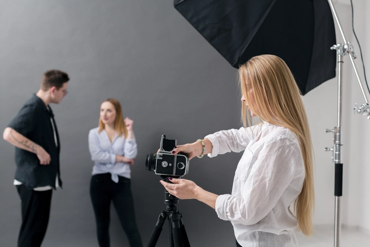 photographer taking photo in studio